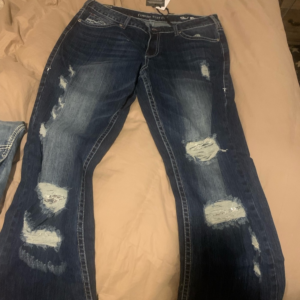 Brand new with tags. Tough jeans, size 32, waist 35 long.